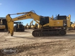 Side of Used Excavator in yard for Sale